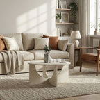 Tavolino da salotto rotondo cashmere con base a croce e intagli ad arco Lemmar